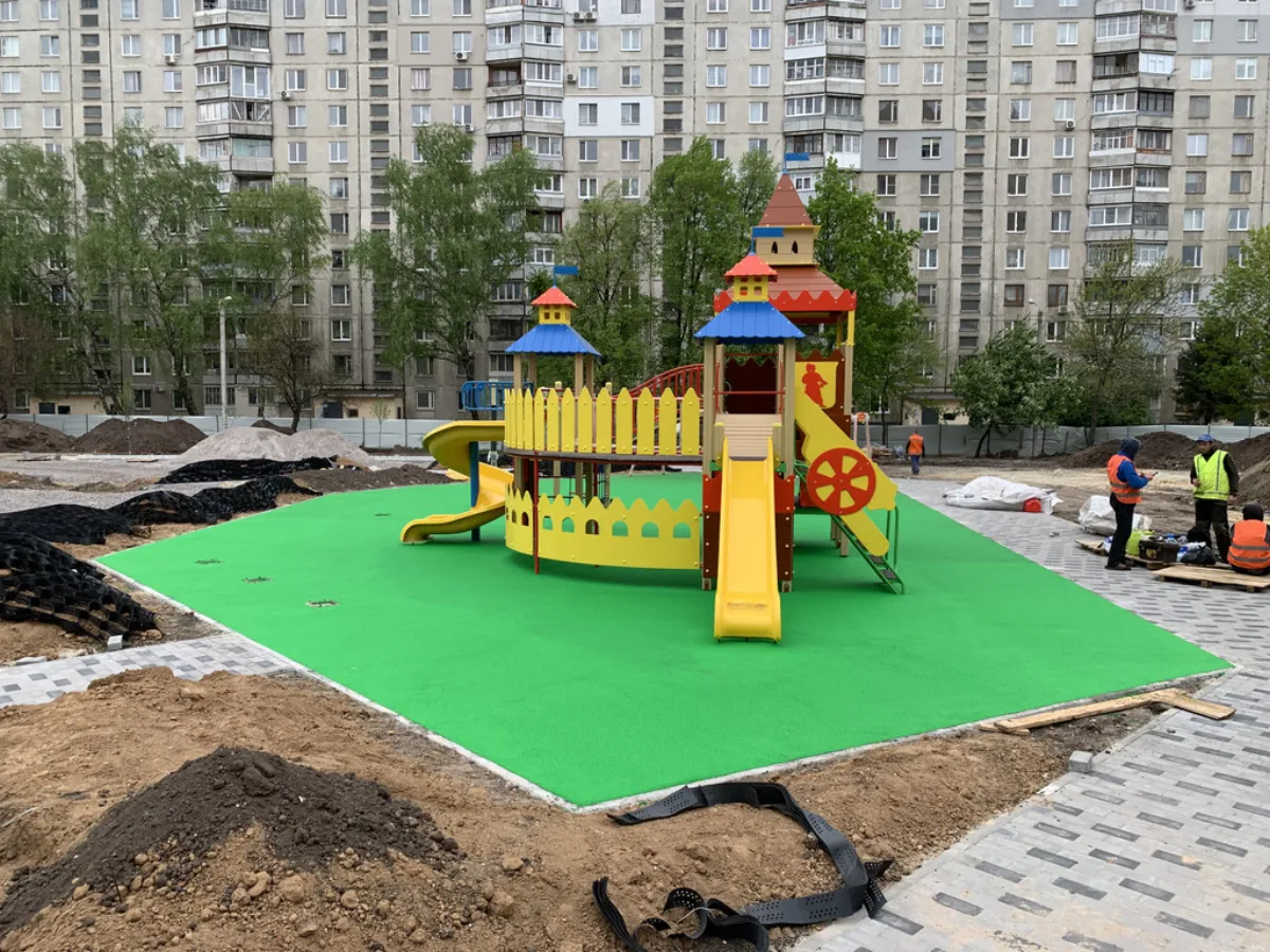 Rubber surface installation for a playground