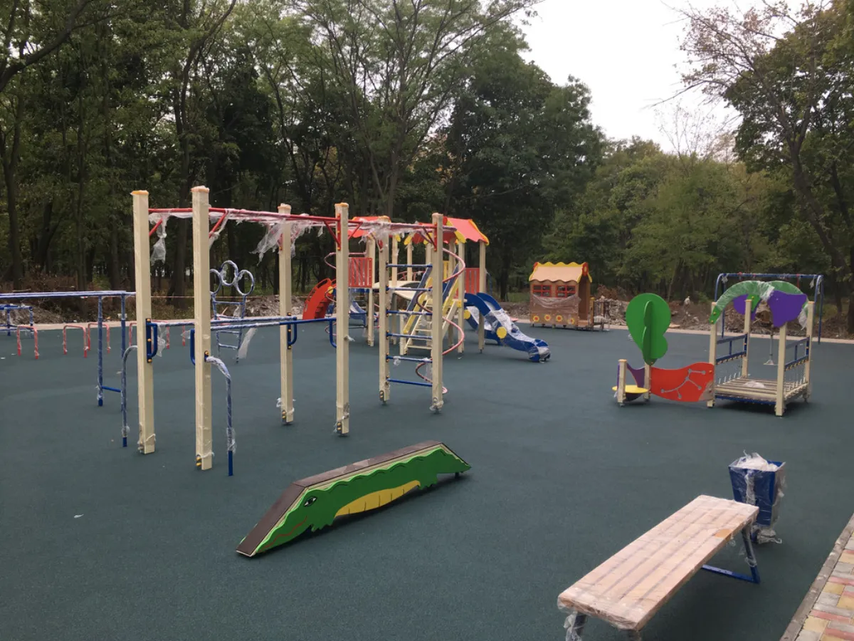 Impact-absorbing playground surface